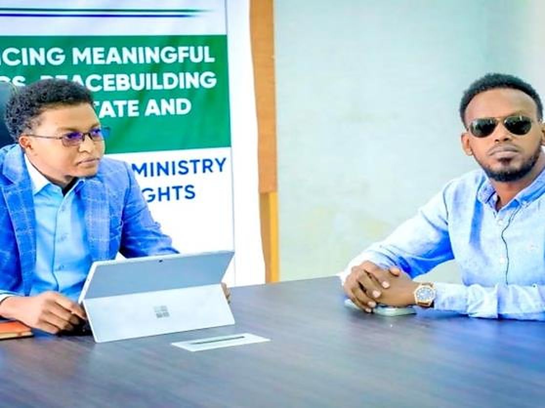 Two staff members at a desk during a training